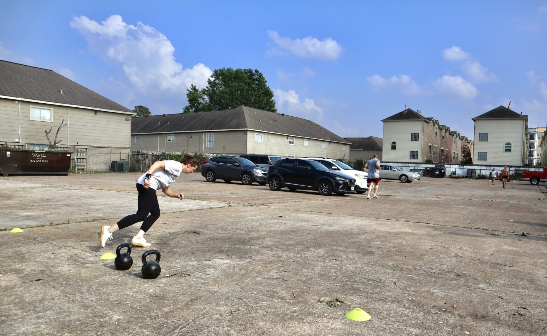 A strong woman runs fast during her workouts with friends at Black Wolf CrossFit in Oak Forrest, Independence Heights, Houston.